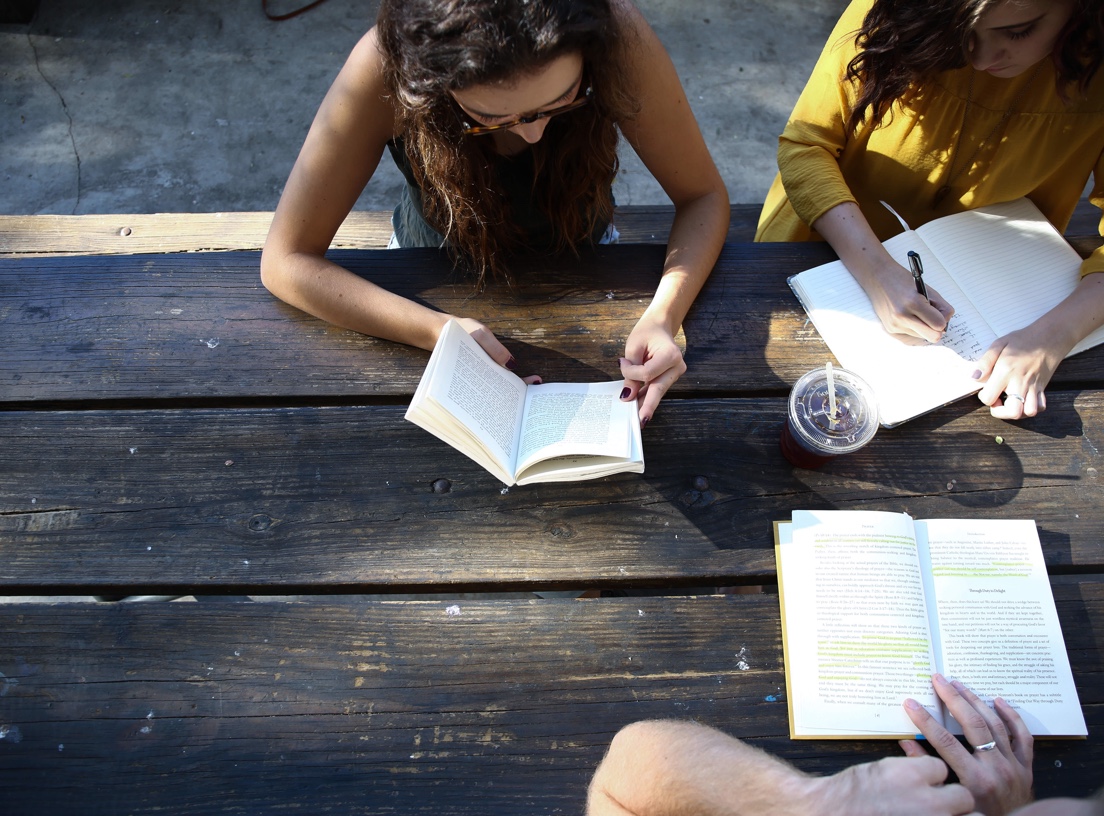 Students studying on a picnic table