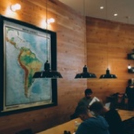 Students studying below a map of South America